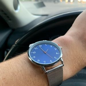 Silver watch with blue dial